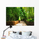 A small road through the bamboo forest. Wall Mural