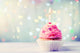 Delicious birthday cupcake on wooden table Wall Mural
