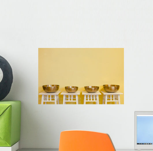 row of therapeutic Tibetan singing bowls Wall Mural