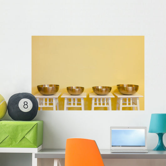 row of therapeutic Tibetan singing bowls Wall Mural
