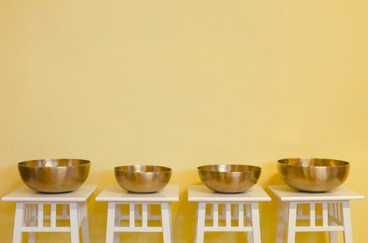 row of therapeutic Tibetan singing bowls Wall Mural