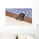 Common house mouse  looks out from a mink in the wall Wall Mural
