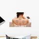 Asian woman is doing massage of electrical -stimulation ( TENs ) Wall Mural