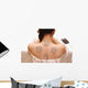 Asian woman is doing massage of electrical -stimulation ( TENs ) Wall Mural