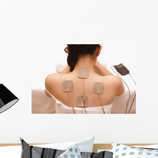 Asian woman is doing massage of electrical -stimulation ( TENs ) Wall Mural