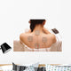 Asian woman is doing massage of electrical -stimulation ( TENs ) Wall Mural