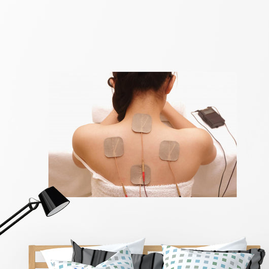 Asian woman is doing massage of electrical -stimulation ( TENs ) Wall Mural