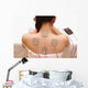 Asian woman is doing massage of electrical -stimulation ( TENs ) Wall Mural
