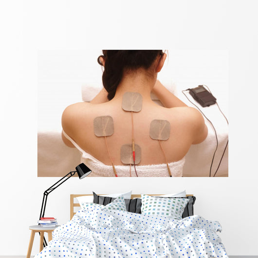 Asian woman is doing massage of electrical -stimulation ( TENs ) Wall Mural