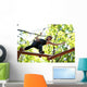 woman climbing in adventure rope park in safety equipment Wall Mural