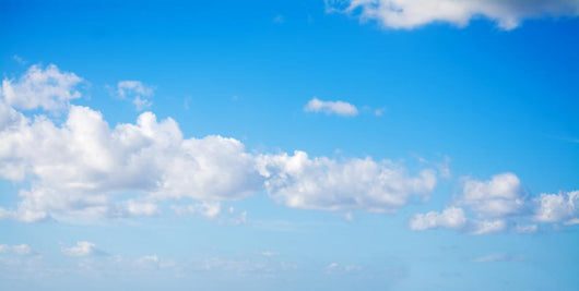 white clouds in the blue sky Wall Mural