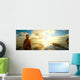 Woman a backpack looking at the sunset. Wall Mural