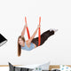 Young woman doing  aerial yoga Wall Decal