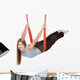 Young woman doing  aerial yoga Wall Decal