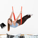 Young woman doing  aerial yoga Wall Decal