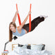 Young woman doing  aerial yoga Wall Decal
