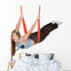 Young woman doing  aerial yoga Wall Decal