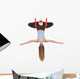 Young woman doing aerial yoga in hammock on a Wall Decal