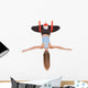 Young woman doing aerial yoga in hammock on a Wall Decal