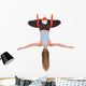 Young woman doing aerial yoga in hammock on a Wall Decal