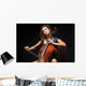 beautiful female musician playing a cello. Wall Mural