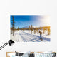 Cross-country skiing in Scandinavian winter landscape at sunset Wall Mural