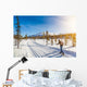 Cross-country skiing in Scandinavian winter landscape at sunset Wall Mural