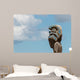 Maori totem against blue sky Wall Mural