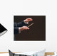 Concert conductor's hands with a baton, isolated on a black Wall Mural