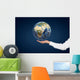 Hand holding Planet. Wall Mural