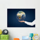 Hand holding Planet. Wall Mural