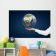 Hand holding Planet. Wall Mural