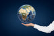Hand holding Planet. Wall Mural