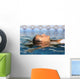 Profile of a beauty relaxed woman face floating in water Wall Mural