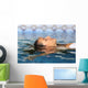 Profile of a beauty relaxed woman face floating in water Wall Mural