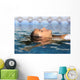 Profile of a beauty relaxed woman face floating in water Wall Mural