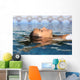 Profile of a beauty relaxed woman face floating in water Wall Mural