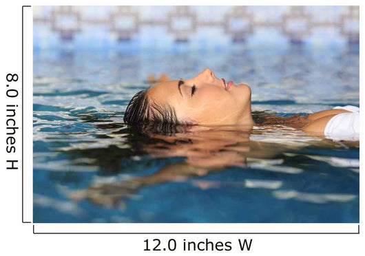 Profile of a beauty relaxed woman face floating in water Wall Mural