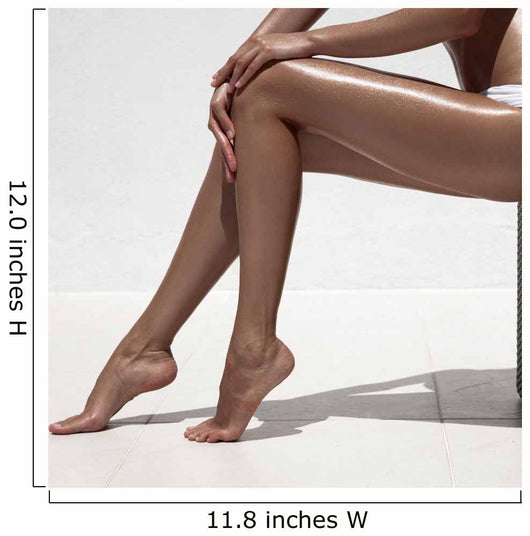 Beautiful woman tan legs. Against white wall. Wall Mural