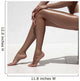 Beautiful woman tan legs. Against white wall. Wall Mural