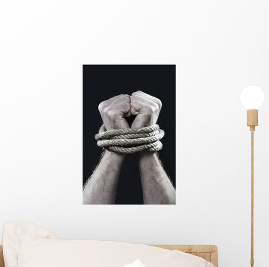 white man hands wrapped rope around wrists victim abused concept Wall Mural