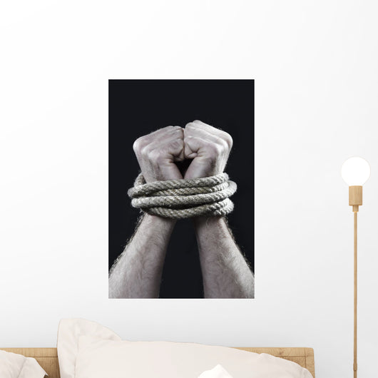 white man hands wrapped rope around wrists victim abused concept Wall Mural