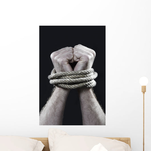 white man hands wrapped rope around wrists victim abused concept Wall Mural