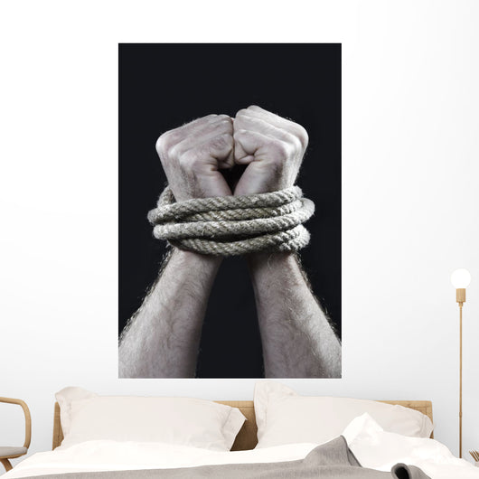 white man hands wrapped rope around wrists victim abused concept Wall Mural