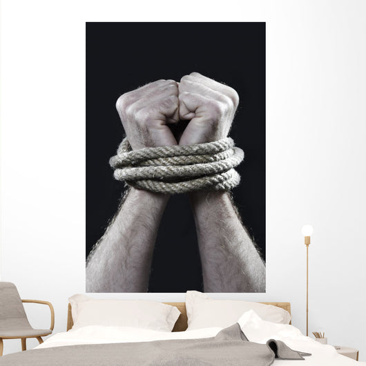white man hands wrapped rope around wrists victim abused concept Wall Mural