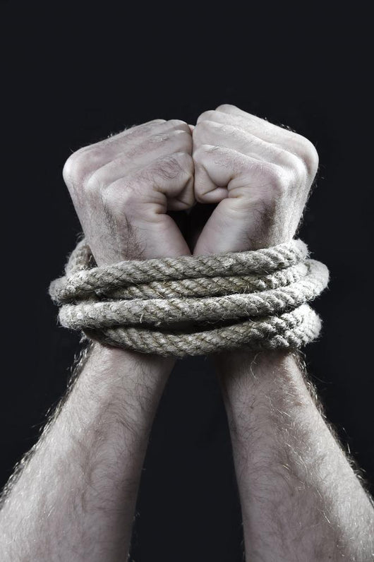 white man hands wrapped rope around wrists victim abused concept Wall Mural