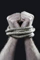 white man hands wrapped rope around wrists victim abused concept Wall Mural