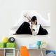 beautiful woman wearing a hakama practicing Aikido Wall Mural