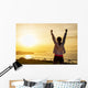 Successful sporty woman with arms up Wall Mural