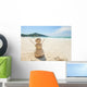 snowman made of sand on a background of the tropical warm sea Wall Mural